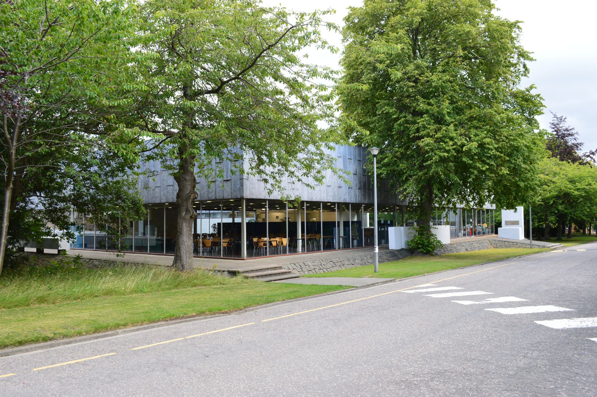 Image of the Dining hall behind some trees