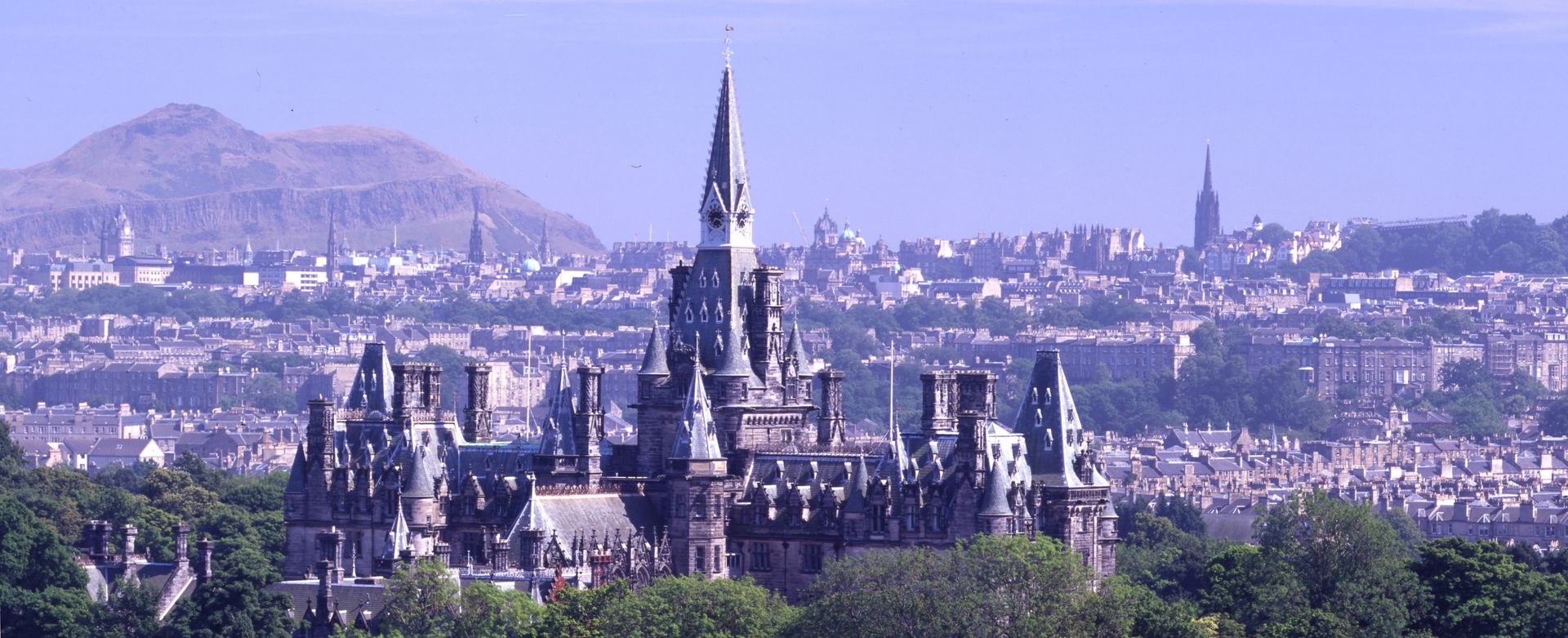 Aerial image showing the back of the main building with the Edinburgh skyline as the backdrop