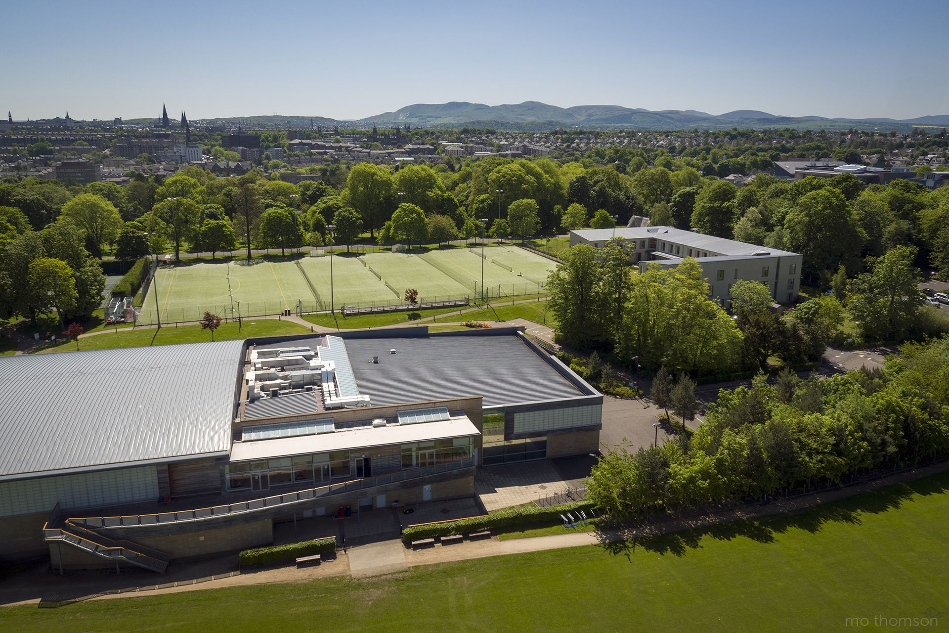 Aerial image showing the top of WestWoods with the Sutcliffe pitches and Dalmeny House in the background